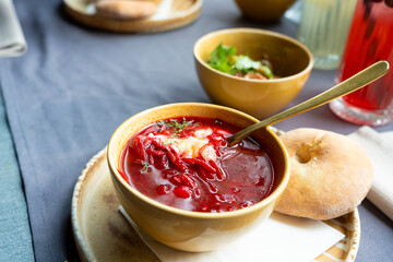 Borscht or borsch in bowl, Ukrainian beetroot soup. Red chowder thick borscht with sour cream