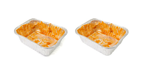 Empty aluminium foil tray isolated, lasagne food remains in dirty packaging for heating, food waste