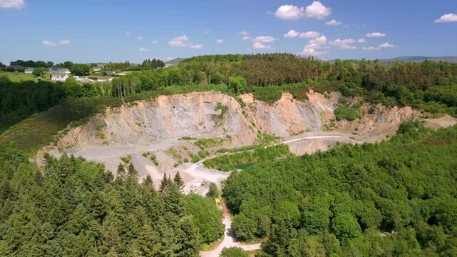 Reversing aerial video of a quary in Warrenpoint, County Down, Northern Ireland, UK on a bright and sunny day. Filmed in 4K, 60FPS and with Rec709 color.