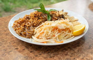 Pad thai or phad tha asian noodles closeup. Chinese rice pasta, phat thai with meat, noodles