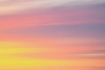 Obraz premium Soft Pastel Sky Gradient with Yellow Pink and Purple Hues