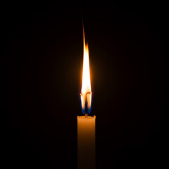 A single candle flame burning brightly in the dark. A powerful symbol for hope, faith, prayer, remembrance, or a romantic vigil. Isolated on a black background with copy space.