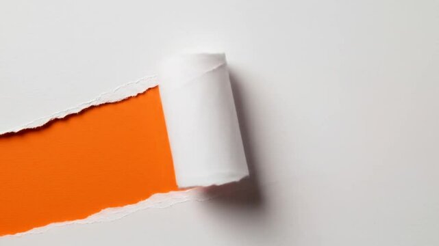 Torn paper revealing orange background