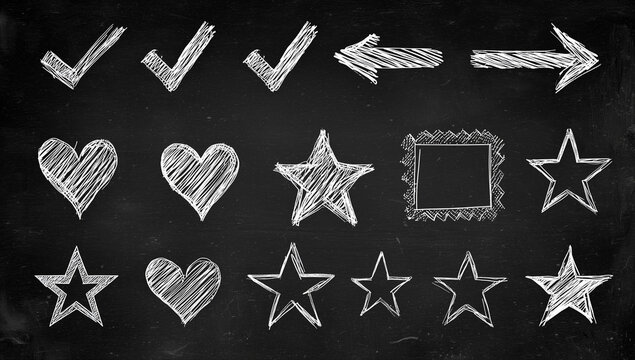 Chalk doodles of arrows stars and hearts on blackboard