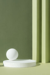 White round podium on an abstract green background. A scene with a geometric backdrop. Showcase,...