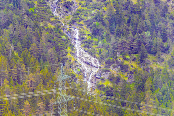 Waterfall in the mountains between forest in Reutte Tyrol Austria.