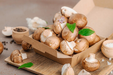 Fresh raw cremini mushrooms with spices and herbs. Healthy ingredient for cooking vegan food