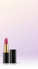 Obraz premium Elegant Gold-Accented Lipstick Display Against a Delicate Gradient Background