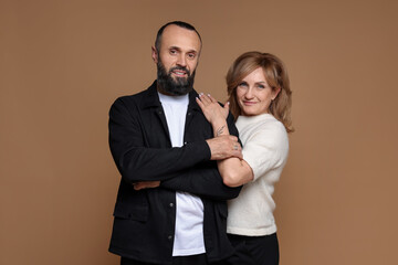 Portrait of lovely couple on brown background