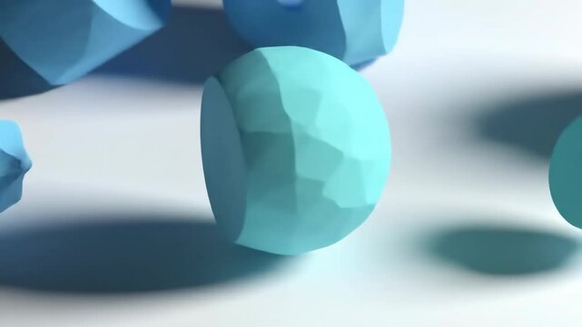 Blue geometric objects rolling and casting shadows in fluid motion on smooth surface