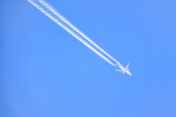 Airplane trails on the blue sky