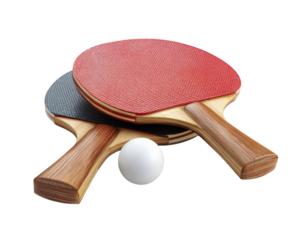 Table tennis paddles with red and black rubber surfaces are placed on transparency background alongside white ping pong ball, creating vibrant and dynamic sports scene