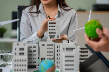 Engineer Teamwork Meeting, with partner on model building at company office working technology,...