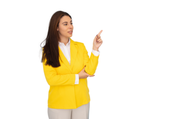 Young businesswoman wearing yellow jacket pointing with index finger to the side while slightly smiling on a transparent background