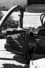 Monochrome muscle, a water pump frozen in time. Silent workhorse, its form a testament to function...