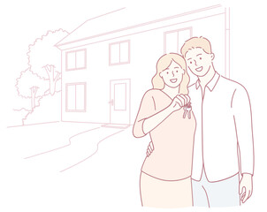 An excited couple joyfully celebrates their new home ownership by proudly holding up their house keys