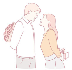 A couple enjoying a romantic moment surrounded by flowers and a thoughtful gift. Love is in the air