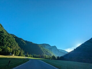 Panoramic view of Logarska dolina valley with peaks of Slovenian Alps covered by passing clouds.