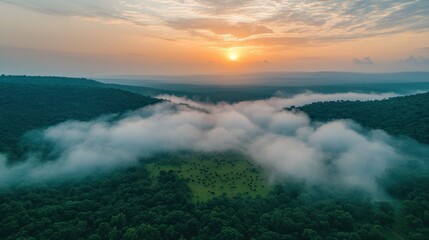 Naklejka premium Misty sunrise over valley