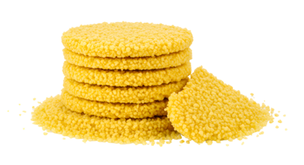 Stacked yellow semolina discs on a white background, showcasing their texture, ideal for culinary presentations or recipes