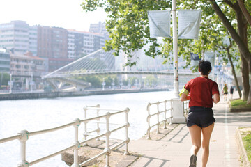 Man running in the park in the downtown of Bilbao