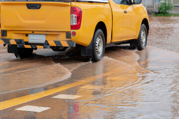 Heavy rain causes urban flooding as water covers streets, disrupting daily life and transportation.