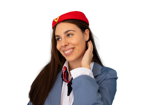 Cheerful flight attendant wearing uniform, touching her hair and smiling, isolated on transparent background