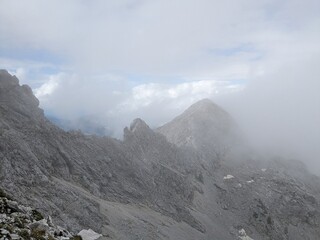 Panoramic view of Logarska dolina valley with peaks of Slovenian Alps covered by passing clouds. © Semi