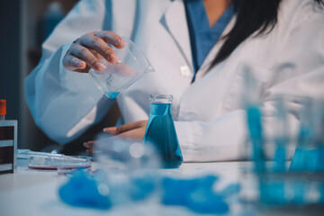 Fototapeta premium Research, experiment and medical trial being done by a scientist in a lab, science facility or hospital. One young, serious and professional researcher organizing, sorting or making a discovery