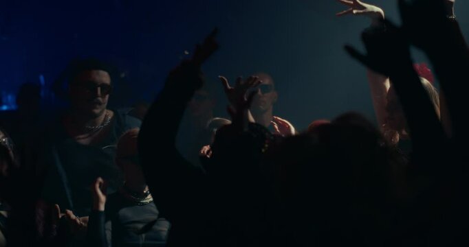 Crowded Modern Nightclub with Diverse Beautiful People Dancing to Dynamic Electronic Music. Lights Pulse in Sync with the Beat. Joyful, Youthful and Hedonistic Atmosphere