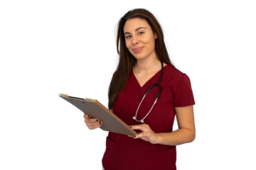 Young female doctor wearing maroon scrubs and stethoscope, holding a clipboard and smiling on a transparent background