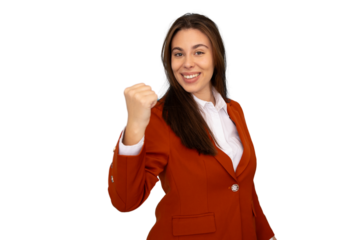 Confident businesswoman raising fist in victorious pose, celebrating professional success with energetic workplace triumph