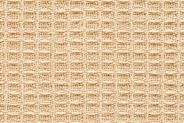 Brown cotton waffle fabric texture as background