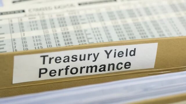 Treasury yields concept. A labeled file folder titled "Treasury Yield Performance" filled with financial documents.