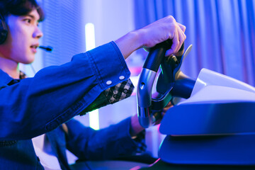 Young gamer intensely plays a racing simulation using a high-end steering wheel controller at home. LED lights and gaming setup create a vibrant esports environment ideal for stock content.
