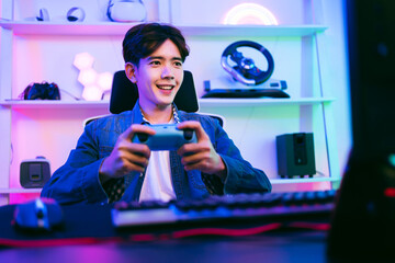 Young man enthusiastically playing video games at home with a game controller, surrounded by neon lighting and modern gear. Ideal for themes of gaming, streaming, fun, and esports lifestyle.