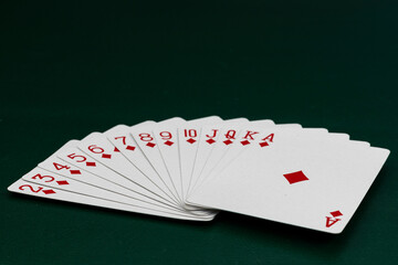 Complete Diamond Suit Playing Cards Fanned Out on Poker Table