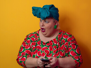Surprised plus size woman looking at smartphone screen