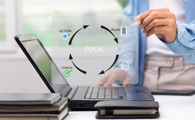 Businessman writing graph diagram PDCA, Plan, Do, Check, Action at workplace in office,  continuous improvement process concept