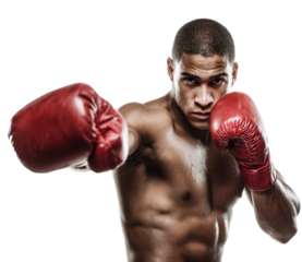 Muscular young man prepares to strike with boxing gloves, showcasing strength and determination in a training environment
