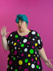 Funny woman raising hands with shocked expression