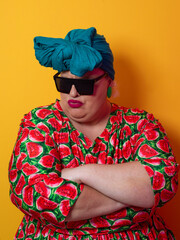 Cool plus size woman crossing arms with sunglasses