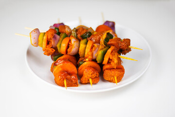 Raw chicken shashlik with vegetable on plate in white background, Raw Grill chicken on plate