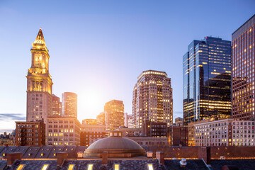 Aerial view of Boston in Massachusetts, USA at night by the North End of the city with its iconic and historic skyscrapers.