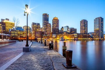 Boston in Massachusetts, USA showcasing its most famous postcard, the water front from the Fan Pier at night.