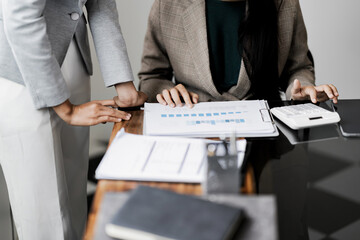 Focused accountant calculating valuation in office with precise documents