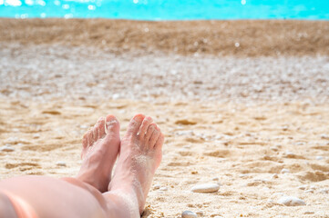 Young woman laying on a beach