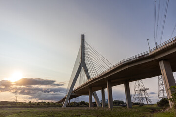 Flintshire Bridge stands prominently in the soft light of early morning, with its cables and...