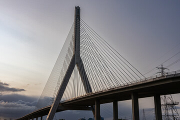 Flintshire Bridge stands prominently in the soft light of early morning, with its cables and...