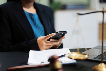 female business woman lawyers working at the law firms. Judge gavel with scales of justice. Legal law, lawyer, documents, advice and justice concept.